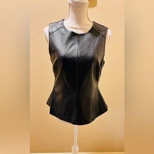 Black faux Leather Peplum top. Fully Lined. Back Zipper. Size LARGE.